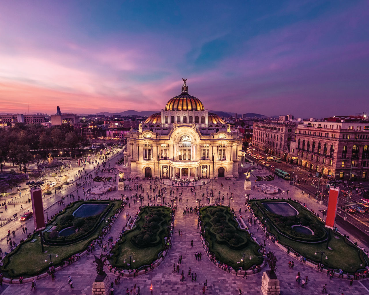 Fantastic view Mexico City's downtown at twilight. The nightlife of the city can be seen around the Palacio de Bellas Artes building in foreground.