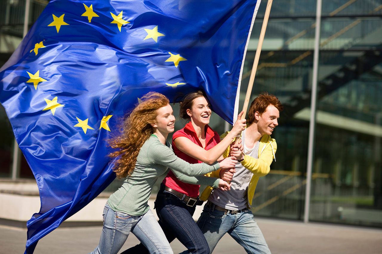 3 flags of the European Union in the wind