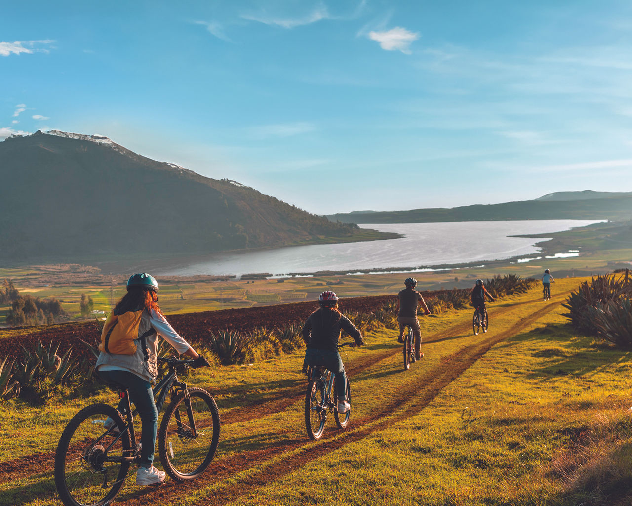 Chincheros, Cusco, Peru June 24, 2021. young people on bicycles at sunset, Laguna de Huaypo; Shutterstock ID 2130150689; NP: CS surveys - Peru 2025